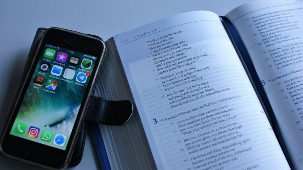 Phone and book representing distraction - Stay focused