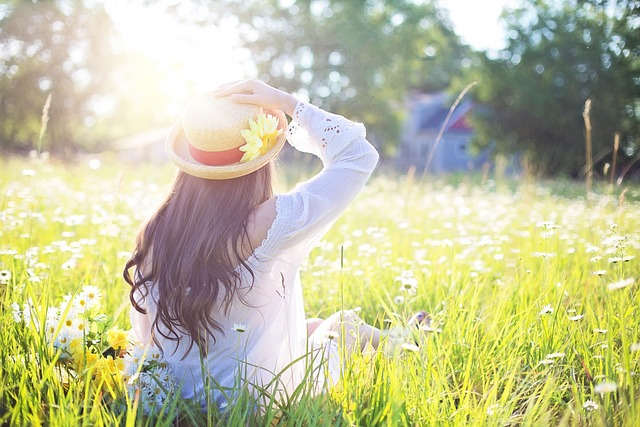 woman, field, sunlight representing summer goals