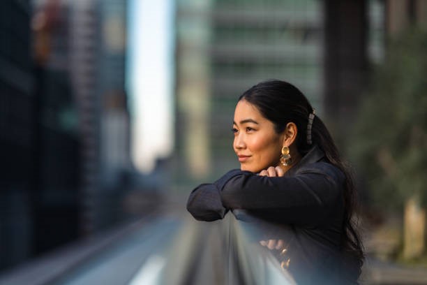 woman looking at the street , representing personal development.