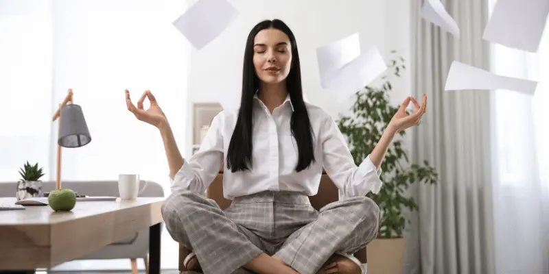 A lady do a meditation on a chair