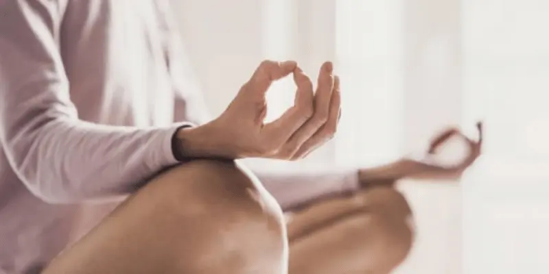woman meditating at home. girl practicing yoga in yoga class